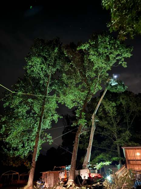 Night job under work lights after a storm