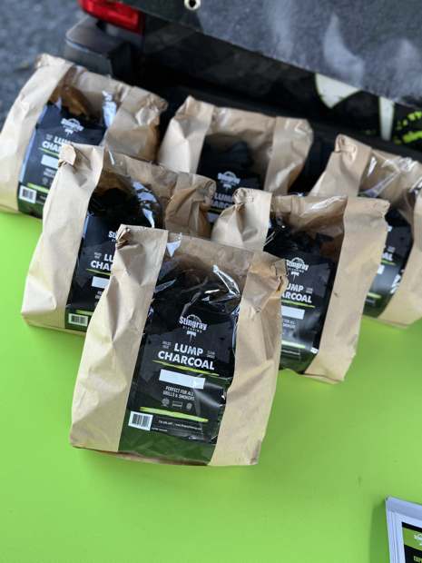 Bags of Stingray smoking chips and lump charcoal